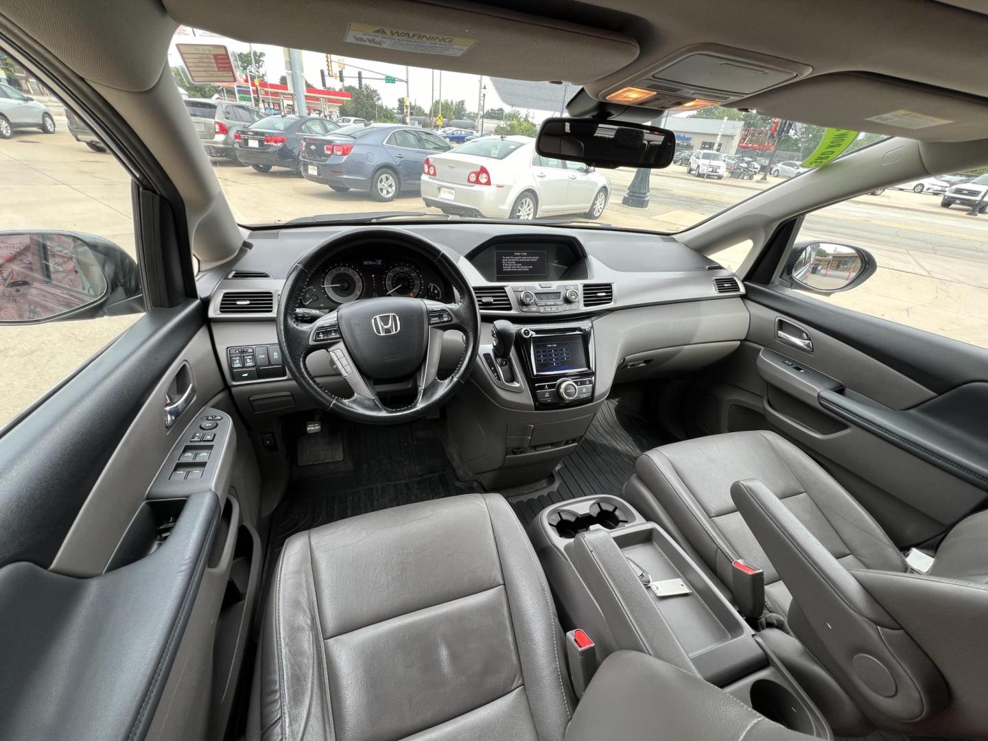 2016 Lunar Silver Metallic /Gray, Leather Honda Odyssey EX-L (5FNRL5H61GB) with an 3.5L V6 SOHC 24V engine, 6A transmission, located at 104 1st Avenue, Silvis, IL, 61282, (309) 755-9511, 41.515156, -90.425377 - Photo#3