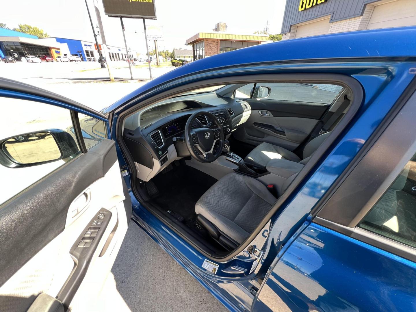 2015 Dyno Blue Pearl /Black, Cloth Honda Civic LX Sedan CVT (2HGFB2F50FH) with an 1.8L L4 SOHC 16V engine, Continuously Variable Transmission transmission, located at 104 1st Avenue, Silvis, IL, 61282, (309) 755-9511, 41.515156, -90.425377 - Photo#3