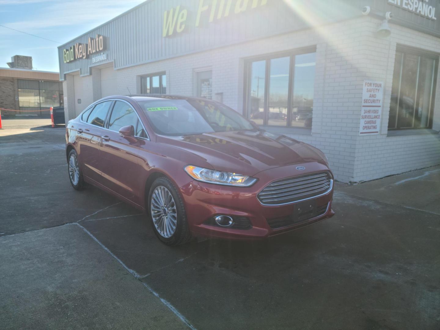 2016 Ruby Red Metallic Tinted Clearcoat /Charcoal Black, Leather Ford Fusion Titanium AWD (3FA6P0D98GR) with an 2.0L L4 DOHC 16V engine, 6A transmission, located at 104 1st Avenue, Silvis, IL, 61282, (309) 755-9511, 41.515156, -90.425377 - Photo#0