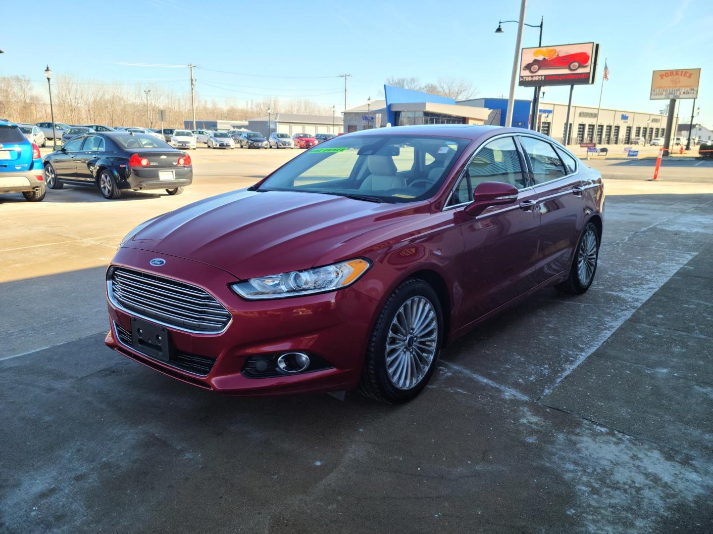 2016 Ruby Red Metallic Tinted Clearcoat /Charcoal Black, Leather Ford Fusion Titanium AWD (3FA6P0D98GR) with an 2.0L L4 DOHC 16V engine, 6A transmission, located at 104 1st Avenue, Silvis, IL, 61282, (309) 755-9511, 41.515156, -90.425377 - Photo#2