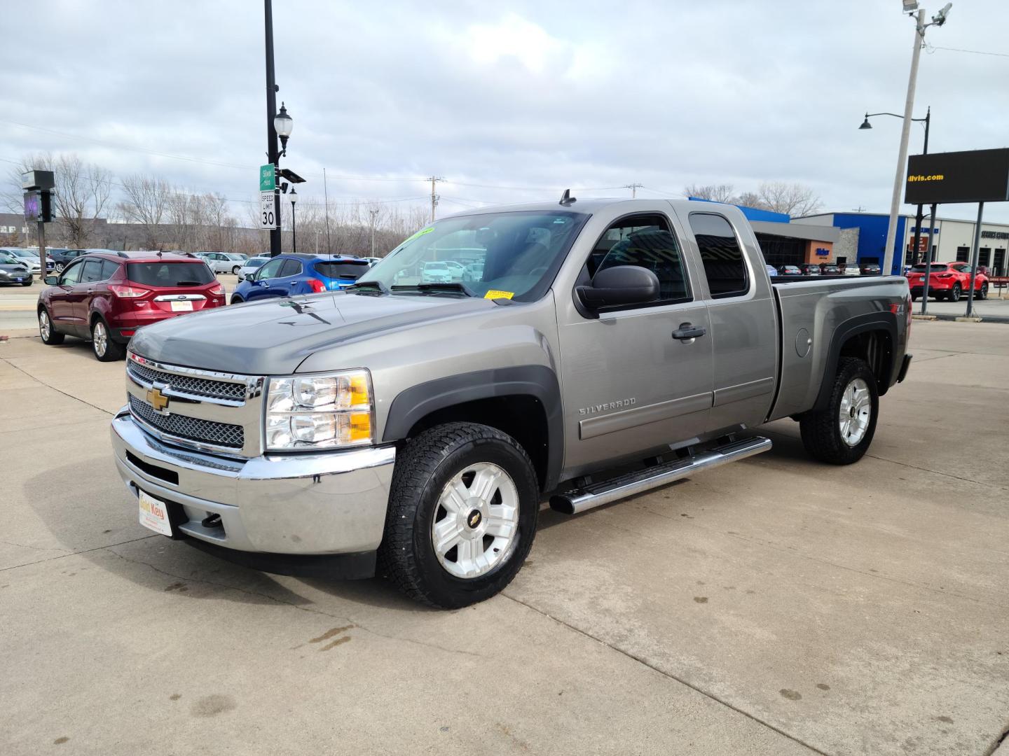 2012 Gray /Black Chevrolet Silverado 1500 LT Ext. Cab Long Box 4WD (1GCRKSE79CZ) with an 5.3L V8 OHV 16V FFV engine, 6-Speed Automatic transmission, located at 104 1st Avenue, Silvis, IL, 61282, (309) 755-9511, 41.515156, -90.425377 - Photo#1