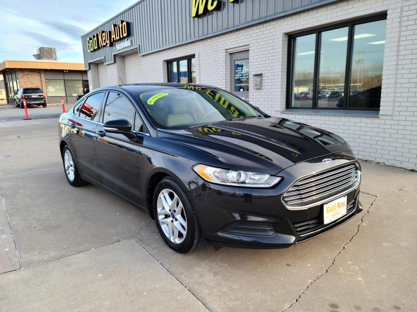 2013 Black /Tan Ford Fusion SE (3FA6P0H72DR) with an 2.5L L4 DOHC 16V engine, located at 104 1st Avenue, Silvis, IL, 61282, (309) 755-9511, 41.515156, -90.425377 - Photo#0