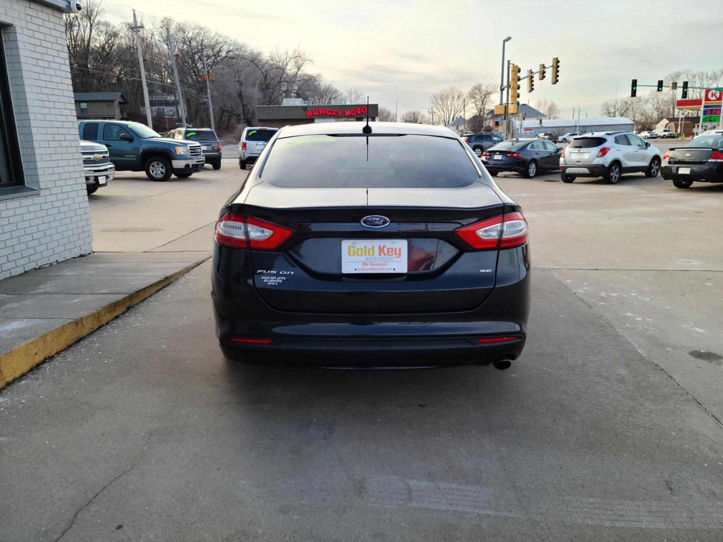 2013 Black /Tan Ford Fusion SE (3FA6P0H72DR) with an 2.5L L4 DOHC 16V engine, located at 104 1st Avenue, Silvis, IL, 61282, (309) 755-9511, 41.515156, -90.425377 - Photo#2