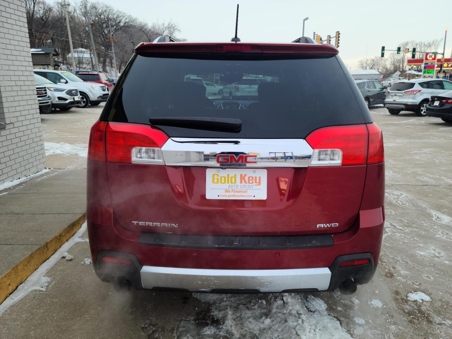 2015 Ruby Red Metallic Tinted Clearcoat /Black GMC Terrain SLT2 AWD (2GKFLYE33F6) with an 3.6L V6 DOHC 24V engine, 6-Speed Automatic transmission, located at 104 1st Avenue, Silvis, IL, 61282, (309) 755-9511, 41.515156, -90.425377 - Photo#1